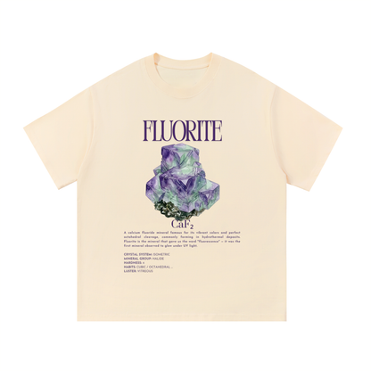 Beige t-shirt with fluorite graphic and text on a white background